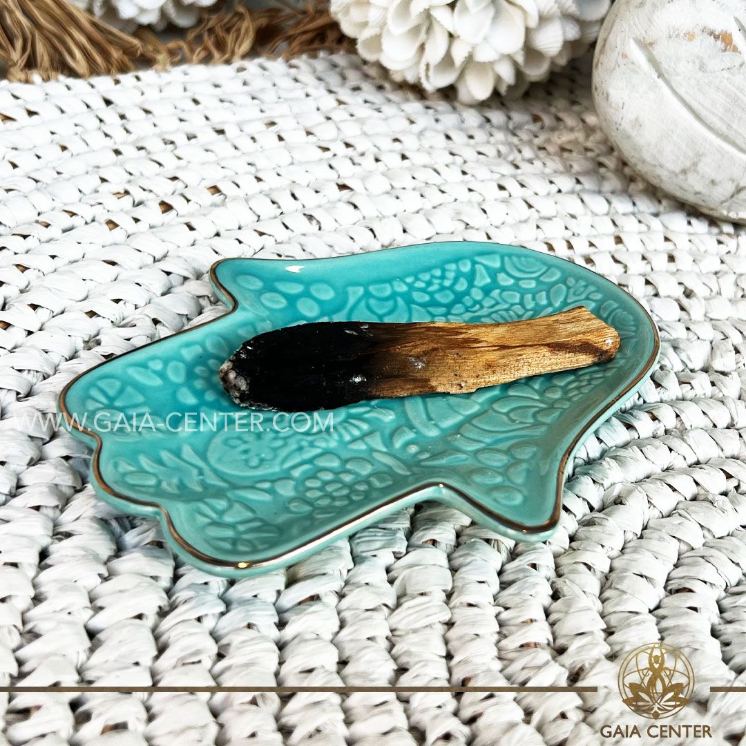 Ceramic Plate - Hamsa Hand Turquoise color Smudging plate for Palo Santo and White Sage at Gaia Center in Cyprus. Shop online at https://gaia-center.com Buy online at Gaia Center | Crystal & Incense Shop in Cyprus. Cyprus islandwide delivery: Limassol, Larnaca, Paphos, Nicosia. Europe and worldwide shipping.