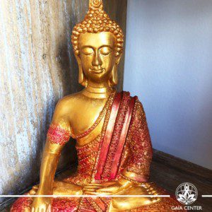 Buddha Statue antique gold and red color finishing. Spiritual items at Gaia Center in Cyprus. Order online: https://www.gaia-center.com Cyprus and International Shipping.