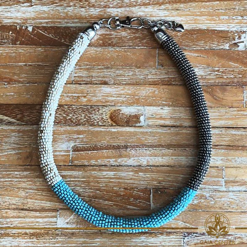 Summer necklace - ring design necklace made from beads cream color, turquoise and silver color. Summer essential jewellery at Gaia Center in Cyprus. Shop online at https://gaia-center.com. Cyprus and Worldwide shipping.