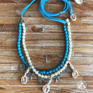 Summer necklace - turquoise and white pearls imitation design with sea shells charms on a string. Summer essential jewellery at Gaia Center in Cyprus. Shop online at https://gaia-center.com. Cyprus and Worldwide shipping.