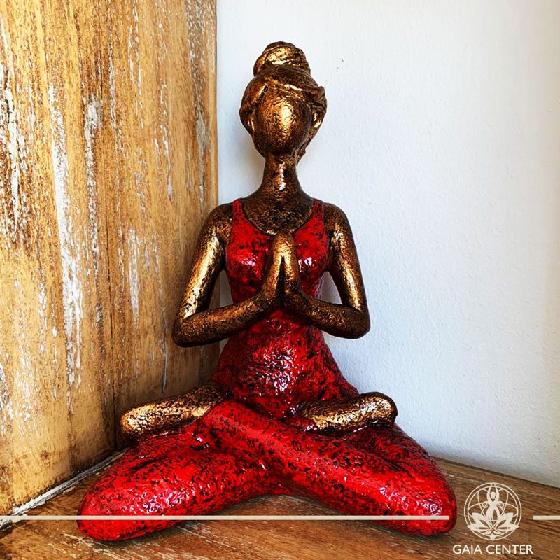 Yoga Lady Meditating Statue - Lotus pose and Hands in Namaste- casted lava sand with antique gold and red color finishing. Spiritual items at Gaia Center in Cyprus. Order online: https://www.gaia-center.com Cyprus and International Shipping.