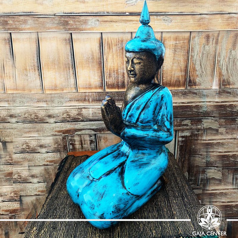Buddha Statue blue and antique gold finishing sitting and meditating with hands gesturing NAMASTE at Gaia Center in Cyprus. Shop online at https://gaia-center.com. Cyprus and Worldwide shipping.