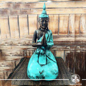 Buddha Statue turquoise and antique gold finishing sitting and meditating with hands gesturing NAMASTE at Gaia Center in Cyprus. Shop online at https://gaia-center.com. Cyprus and Worldwide shipping.