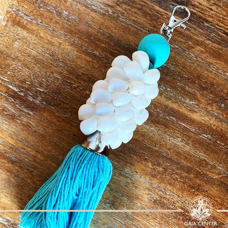 Natural seashell and cotton string key chain-charm at Gaia Center in Cyprus. Shop online at https://gaia-center.com. Cyprus and Worldwide shipping.