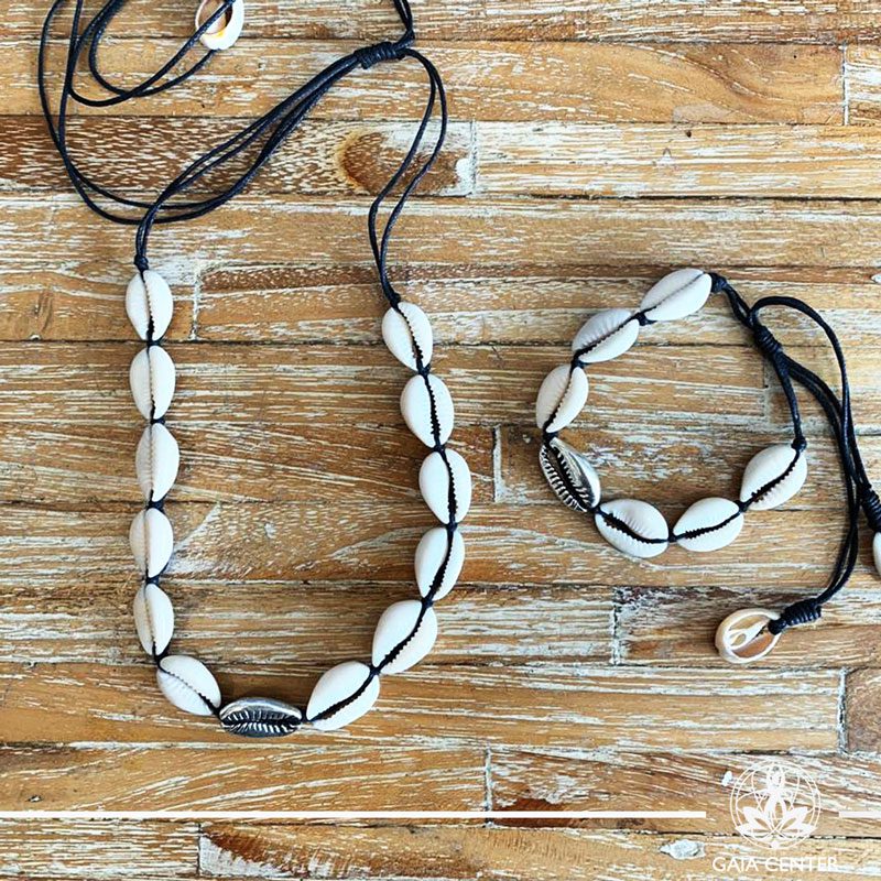 Summer set necklace and bracelet - sea shells on a black color string with silver color charm. Summer essential jewellery at Gaia Center in Cyprus. Shop online at https://gaia-center.com. Cyprus and Worldwide shipping.