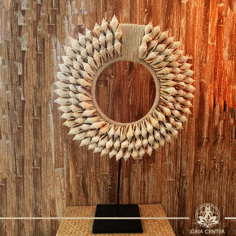 Natural seashell and macrame stand decor at Gaia Center in Cyprus. Shop online at https://gaia-center.com. Cyprus and Worldwide shipping.
