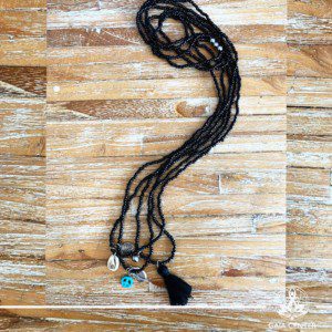 Summer necklace - black color beads sea shell and decor charms. Summer essential jewellery at Gaia Center in Cyprus. Shop online at https://gaia-center.com. Cyprus and Worldwide shipping.