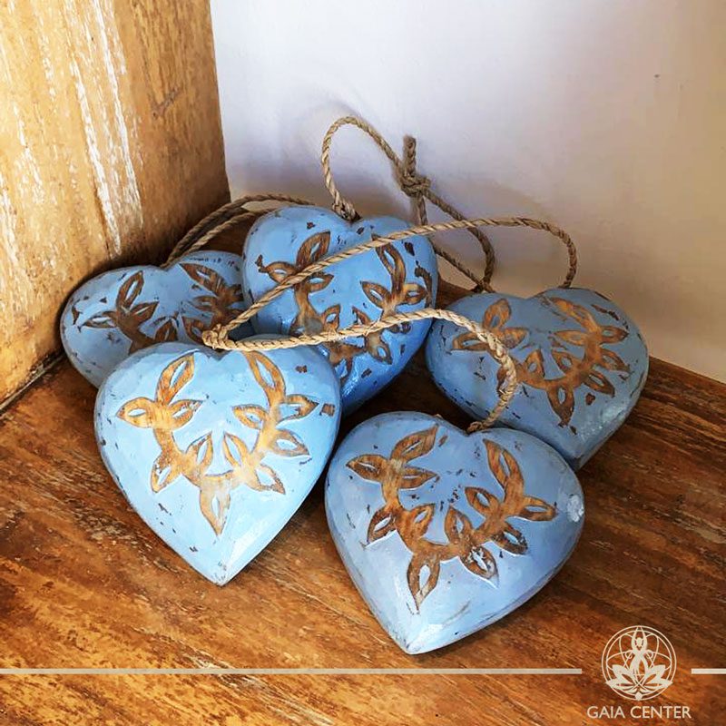 Wooden hand carved hearts on a string blue finishing at Gaia Center in Cyprus. Shop online at https://gaia-center.com. Cyprus and Worldwide shipping.