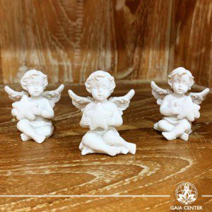 Cherub holding a star mini statue at Gaia Center | Cyprus. Angels and cherubs statues selection.