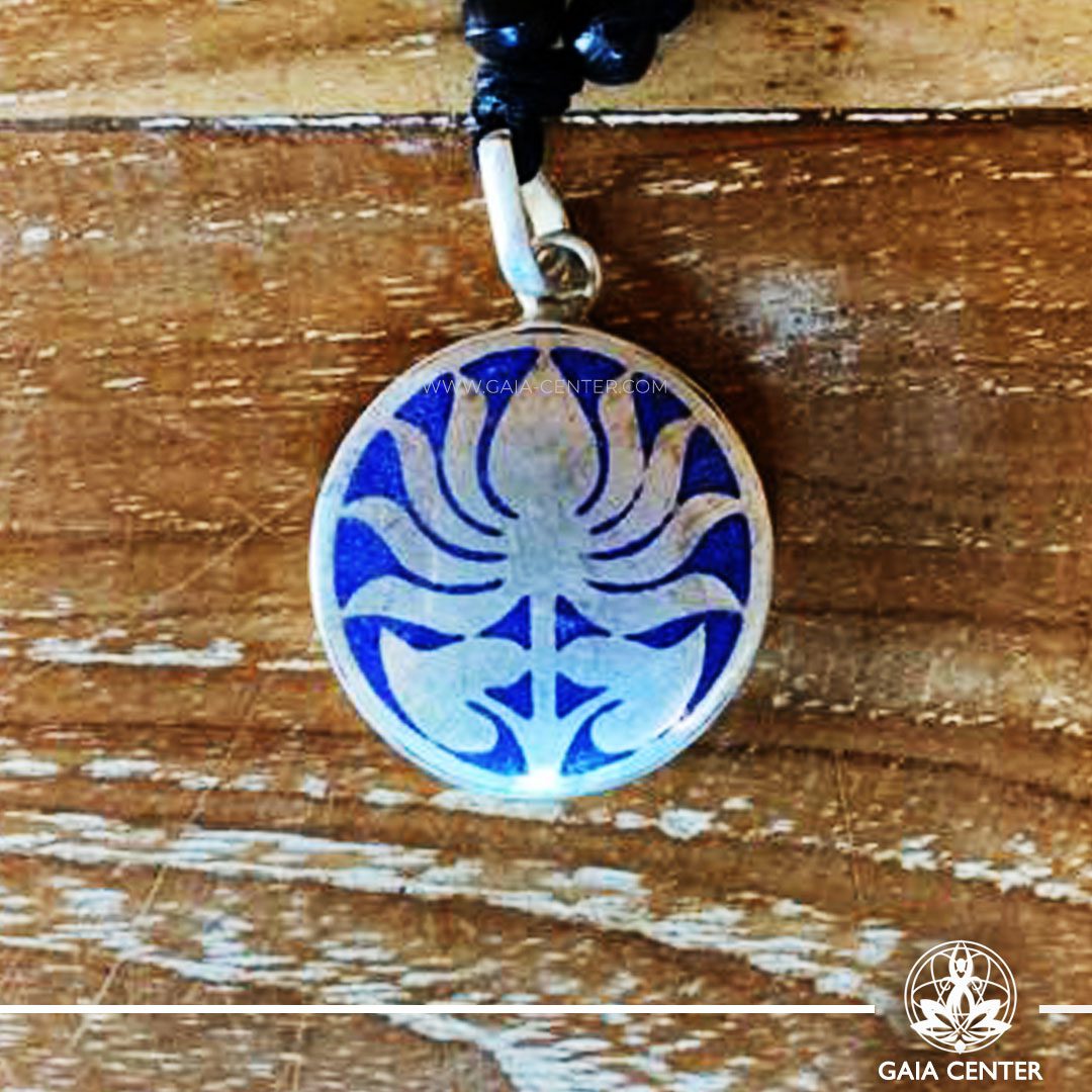 Crystal Pendant and Semiprecious Gemstone. Tibetan Pendant Lotus Flower symbol inlaid with crystal stone - crushed lapis lazuli. Adjustable black string. Selection of Tibetan Jewelry made from crystals, gemstones, combination of metals at Gaia Center | Cyprus.