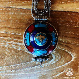 Tibetan gau pendant amulet box selection with semiprecious stones. Tibetan Pendant inlaid with turquoise, coral and lapis lazuli. Buddha Eyes symbol. Long chain. Selection of Tibetan Jewelry made from crystals, gemstones at Gaia Center | Cyprus.