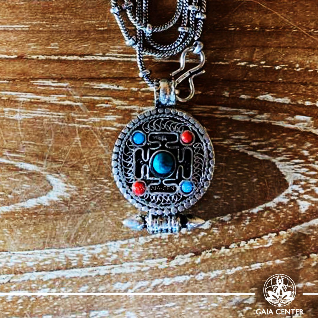 Tibetan Gau box Antique Pendant Kalachakra buddhist symbol. With a metal chain. Tibetan Jewelry made from crystals, semiprecious gemstones, and artistic combination of metals at Gaia Center | Cyprus.