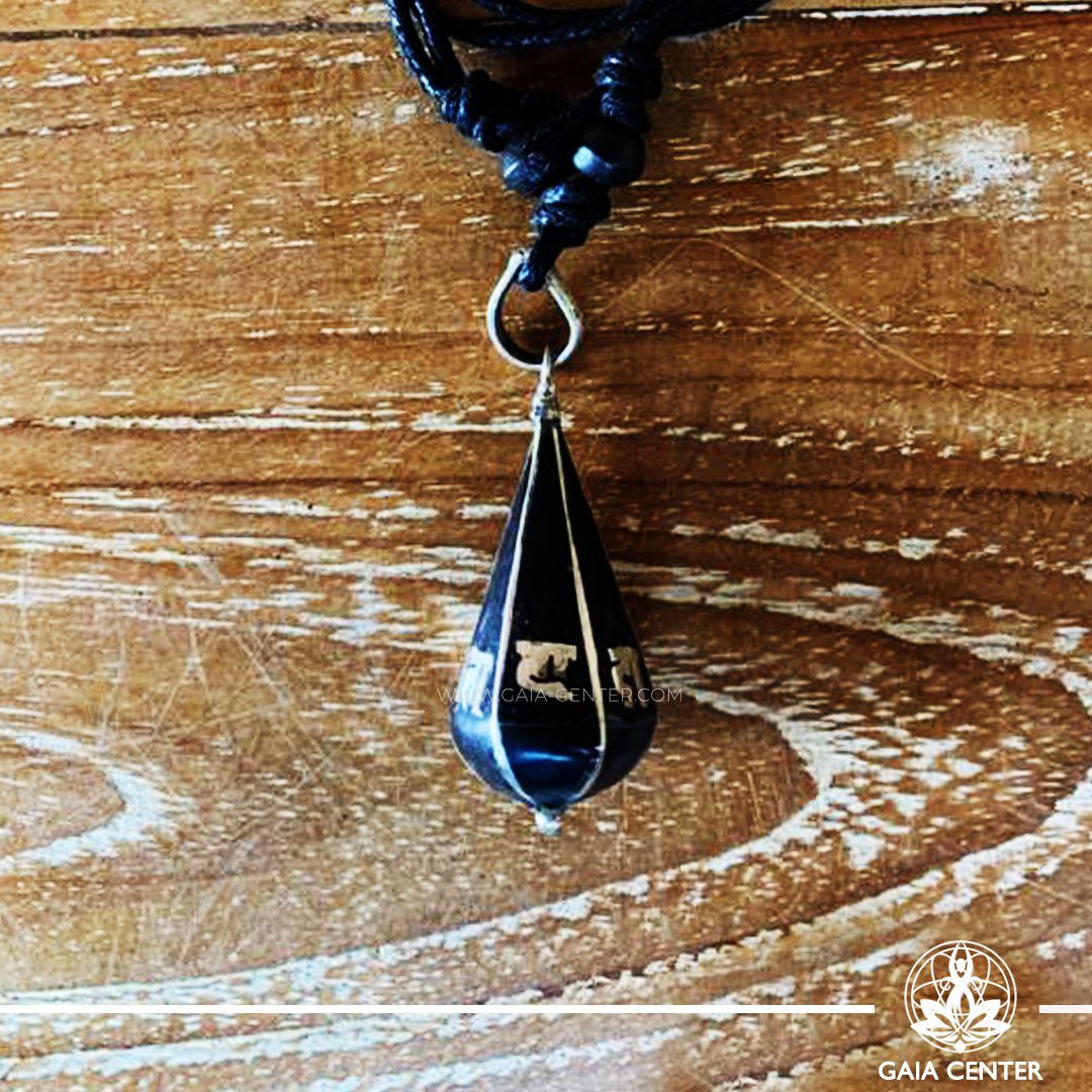 Tibetan Pendant Black Drop Style design. Made from combination of metals and semiprecious stone. Adjustable black cord or string. Selection of Tibetan jewelry at Gaia Center | Cyprus.