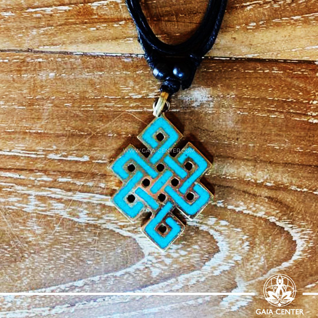 Tibetan Pendant Endless knot buddhist symbol. Metal inlaid with turquoise. Adjustable black string. Selection of Tibetan Jewelry made from crystals, gemstones, combination of metals at Gaia Center | Cyprus.