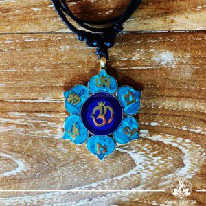 Tibetan Pendant Om symbol and Om mani padme hum in lotus flower design. Lapis lazuli and turquoise. Adjustable black string. Selection of Tibetan Jewelry made of crystals, gemstones, combination of metals at Gaia Center | Cyprus.