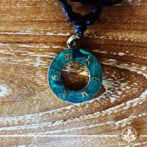 Tibetan Pendant Circle Style design. Made from combination of metals and semiprecious stone. Malachite crushed inlaid with buddhist symbols. Adjustable black cord or string. Selection of Tibetan jewelry at Gaia Center | Cyprus.