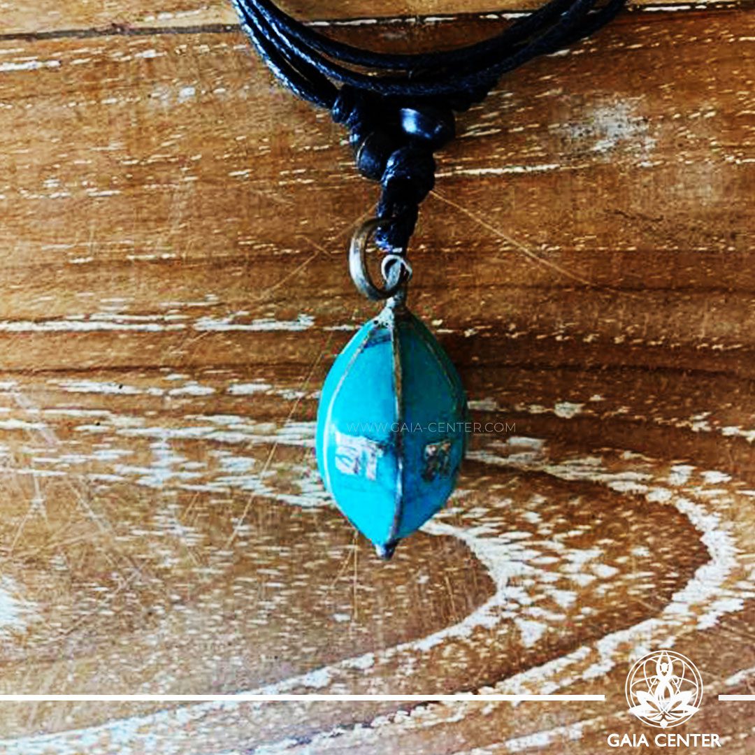 Tibetan Pendant Turquoise Drop Style design. Made from combination of metals and semiprecious stone. Adjustable black cord or string. Selection of Tibetan jewelry at Gaia Center | Cyprus.