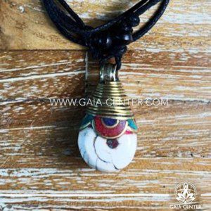 Tibetan Pendant style. Metal inlaid with semiprecious gemstones. Adjustable black string. Selection of Tibetan Jewelry made from crystals, gemstones, combination of metals at Gaia Center | Cyprus.