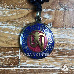 Tibetan Pendant with om symbol. Metal inlaid with semiprecious gemstones. Adjustable black string. Selection of Tibetan Jewelry made from crystals, gemstones, combination of metals at Gaia Center | Cyprus.