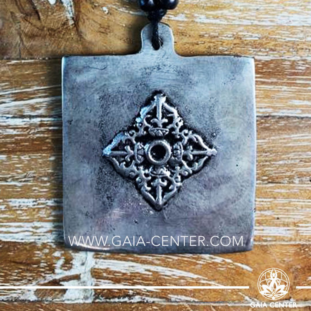 Tibetan Pendant Double Dorje or Vraja design. Made from combination of metals, silver color style. On an adjustable black string. Tibet Selection of Tibetan Jewelry made from crystals, gemstones, combination of metals at Gaia Center | Cyprus.