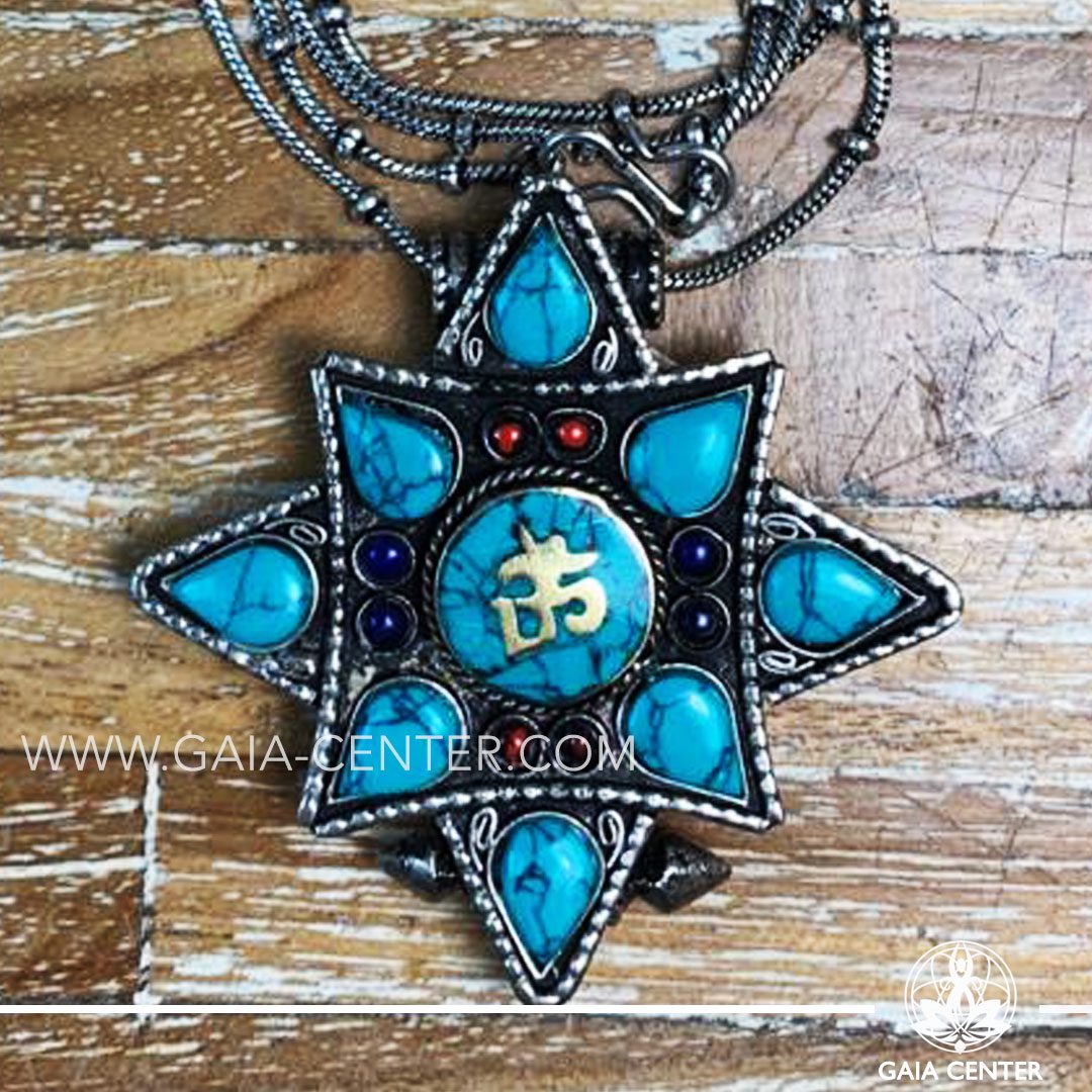 Crystal and Semiprecious Gemstone Pendant. Tibetan Pendant Gau box amulet with Buddha wisdom eyes symbol. Metal inlaid with semiprecious gemstones. Adjustable black string. Selection of Tibetan Jewelry made from crystals, gemstones, combination of metals at Gaia Center | Cyprus.