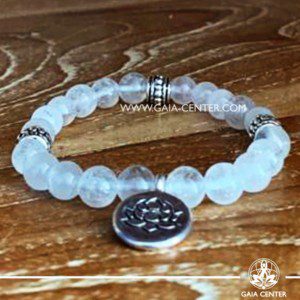 Crystal Mala Bracelet - 21 rock clear quartz crystal beads with lotus symbol metal charm. Elastic string. Crystal and Gemstone Jewellery Selection at Gaia Center in Cyprus.