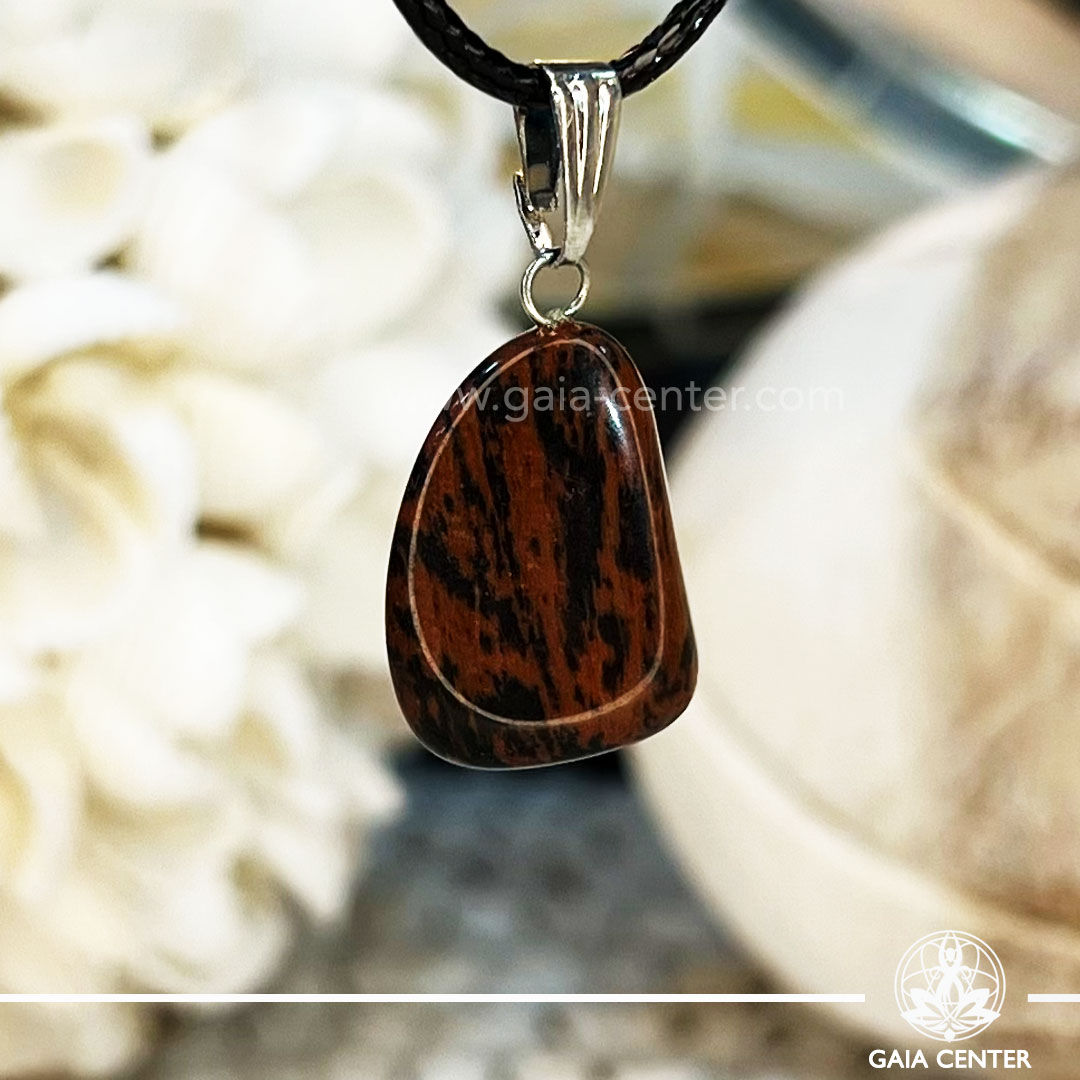 Crystal Pendant - Mahogany obsidian polished with electroplated bail and string at GAIA CENTER Crystal Shop CYPRUS. Crystal jewellery and crystal pendants at Gaia Center crystal shop in Cyprus. Order online top quality crystals, Cyprus islandwide delivery: Limassol, Larnaca, Paphos, Nicosia. Europe and Worldwide shipping.