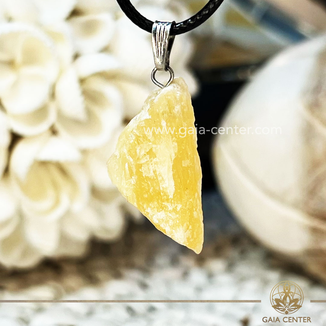 Crystal Pendant - Yellow Calcite Rough with electroplated bail with string zen design at GAIA CENTER Crystal Shop CYPRUS. Crystal jewellery and crystal pendants at Gaia Center crystal shop in Cyprus. Order online top quality crystals, Cyprus islandwide delivery: Limassol, Larnaca, Paphos, Nicosia. Europe and Worldwide shipping.