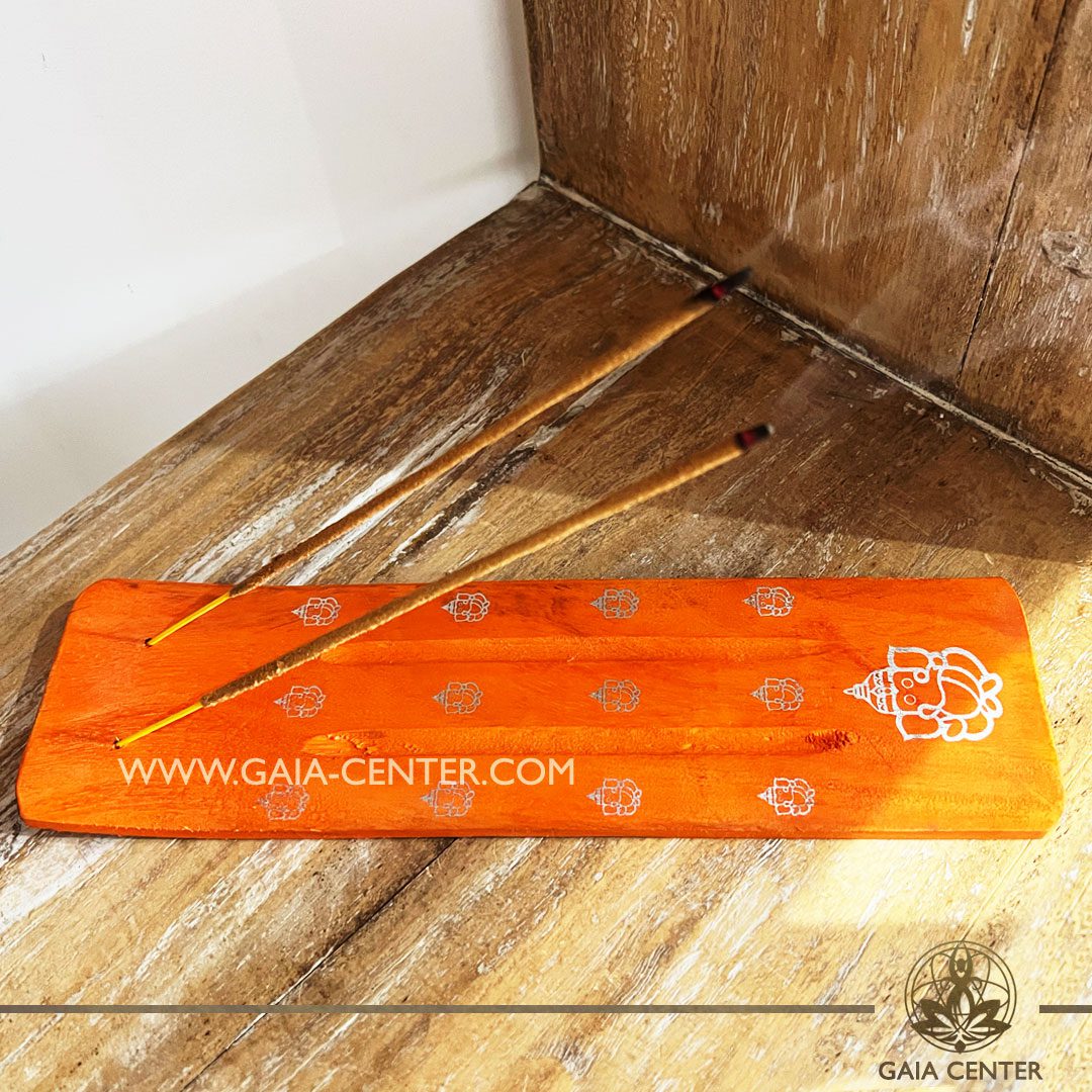 Incense Holder or Ash Catcher for two incense sticks. Made from wood with artistic design: orange color and ganesh symbol. Incense burners selection at Gaia Center | Cyprus.