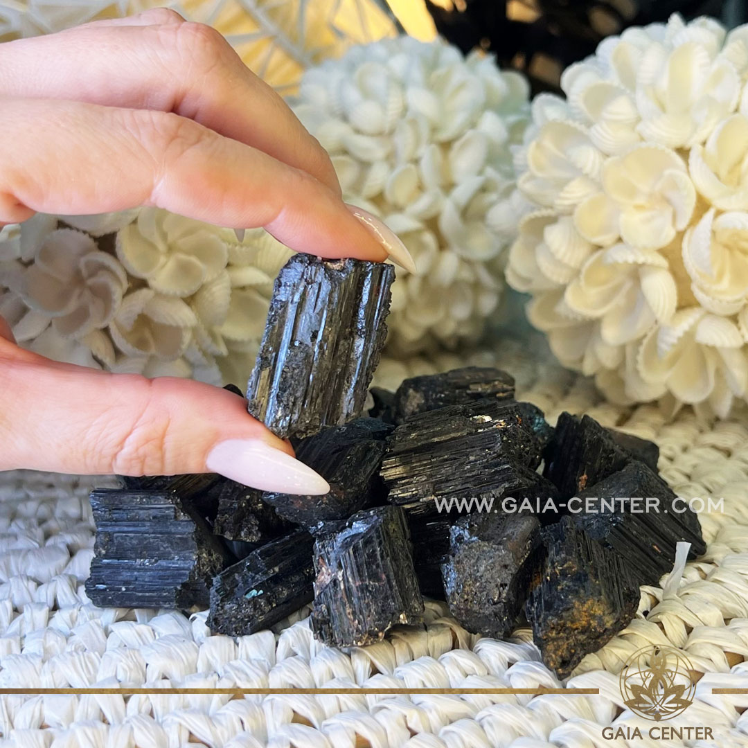 Black Tourmaline Rough natural unpolished crystal cluster from Brazil at GAIA CENTER Crystal shop in Cyprus. Black tourmaline rough crystals possess the unique ability to cleanse and purify the energetic field, dissolving blockages and stagnant energy. Crystal tumbled stones and rough minerals, drusy at Gaia Center crystal shop in Cyprus. Order crystals online top quality crystals, Cyprus islandwide delivery: Limassol, Larnaca, Paphos, Nicosia. Europe and Worldwide shipping.