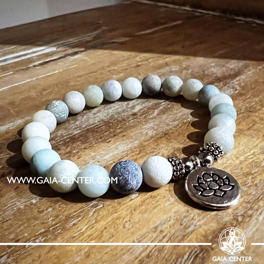 Crystal Bracelet Amazone Stone with metal Lotus Flower charm and elastic string - made with 8mm gemstone beads. Crystal and Gemstone Jewellery Selection at Gaia Center in Cyprus. Order online, Cyprus islandwide delivery: Limassol, Larnaca, Paphos, Nicosia. Europe and Worldwide shipping.