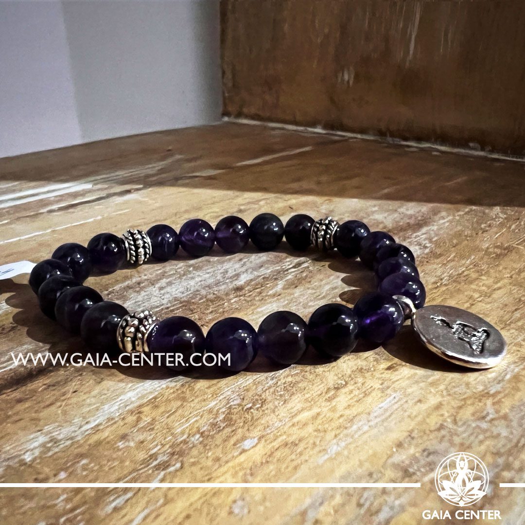 Crystal Bracelet Amethyst Quartz with metal Buddha charm and Elastic string - made with 8mm gemstone beads. Crystal and Gemstone Jewellery Selection at Gaia Center in Cyprus. Order online, Cyprus islandwide delivery: Limassol, Larnaca, Paphos, Nicosia. Europe and Worldwide shipping.