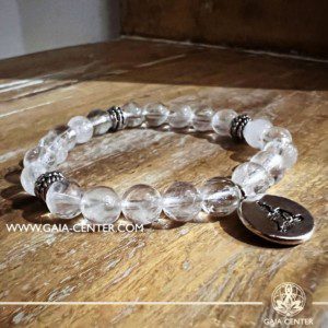 Crystal Bracelet Rock Crystal Quartz with metal Buddha charm and Elastic string - made with 8mm gemstone beads. Crystal and Gemstone Jewellery Selection at Gaia Center in Cyprus. Order online, Cyprus islandwide delivery: Limassol, Larnaca, Paphos, Nicosia. Europe and Worldwide shipping.