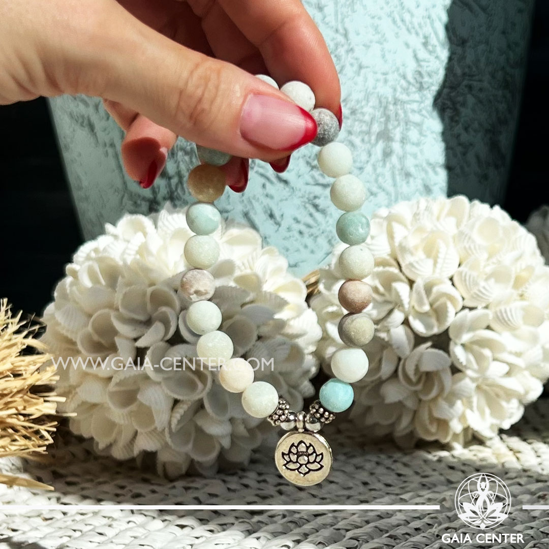 Crystal Bracelet Amazonite with Elastic string and Lotus charm - made with 8mm gemstone beads. Crystal and Gemstone Jewellery Selection at Gaia Center Crystal Shop in Cyprus. Order crystals online, Cyprus islandwide delivery: Limassol, Larnaca, Paphos, Nicosia. Europe and Worldwide shipping.