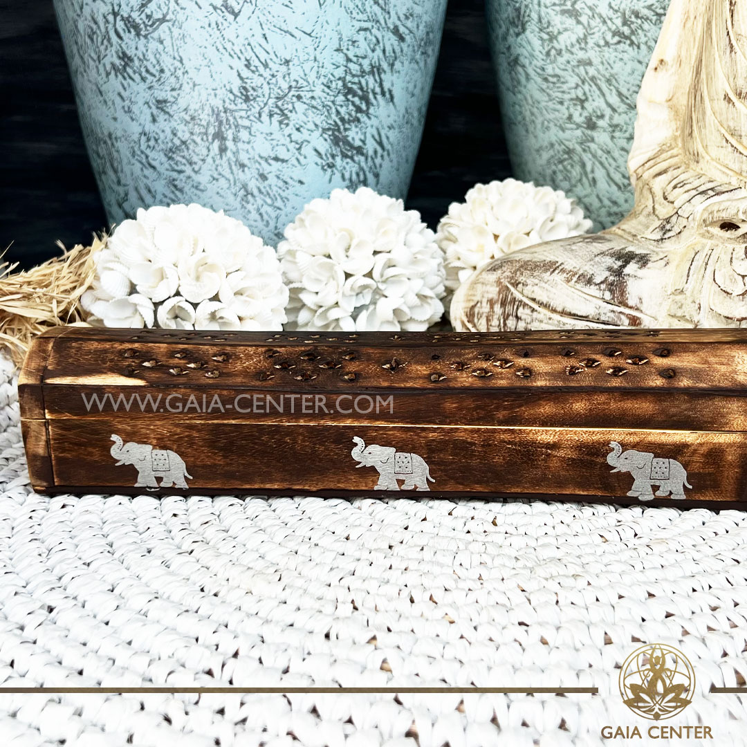 Incense Holder or Ash Catcher - wooden box Elephant design. Holds two aroma incense sticks and two incense pyramids or cones. Made from wood with artistic design: white color elephant symbol. Incense burners selection at Gaia Center Crystal Incense Shop in Cyprus. Order online, Cyprus islandwide delivery: Limassol, Larnaca, Nicosia, Paphos. Europe and worldwide shipping.