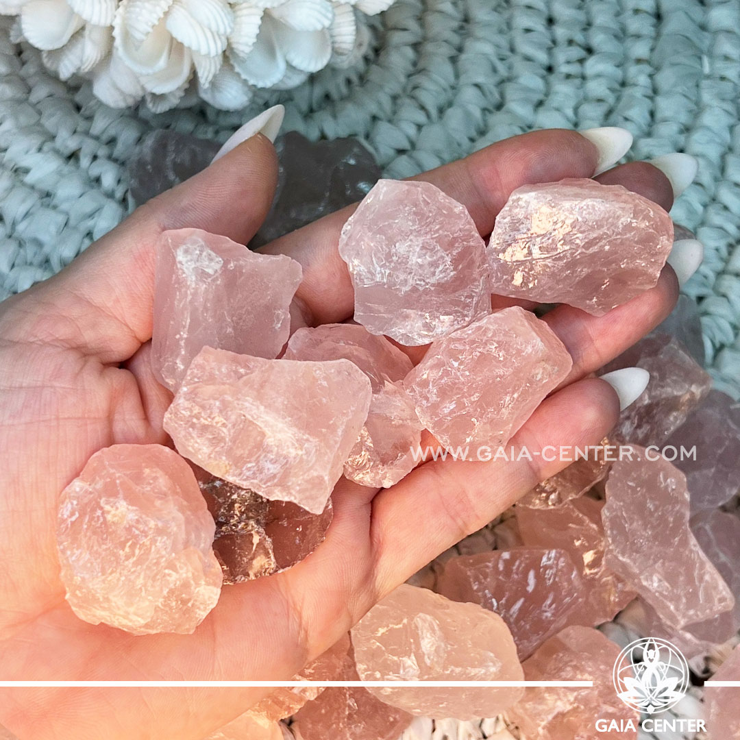 Pink Rose Quartz Rough natural unpolished crystal quartz clusters from Madagascar at GAIA CENTER Crystal shop in Cyprus. Rose Quartz purifies and opens the heart at all levels to promote love, self-love, friendship, deep inner healing and feelings of peace. Rose quartz promotes gentleness and love and stimulates positive emotional interactions, how to love oneself (again) as well as others. Crystal tumbled stones and rough minerals, drusy at Gaia Center crystal shop in Cyprus. Order crystals online top quality crystals, Cyprus islandwide delivery: Limassol, Larnaca, Paphos, Nicosia. Europe and Worldwide shipping.