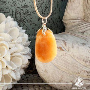Crystal Pendant - Orange Calcite with electroplated bail crystal floral design at GAIA CENTER Crystal Shop CYPRUS. Crystal jewellery and crystal pendants at Gaia Center crystal shop in Cyprus. Order online top quality crystals, Cyprus islandwide delivery: Limassol, Larnaca, Paphos, Nicosia. Europe and Worldwide shipping.