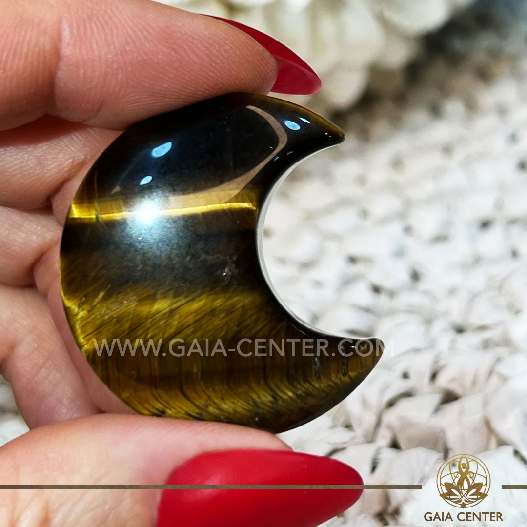 Crystal Moon Shape - Tiger's Eye Gold. Crystals and Gemstone selection at Gaia Center Crystal Shop Cyprus. Shop online at https://gaia-center.com. Cyprus island delivery: Limassol, Nicosia, Paphos, Larnaca. Europe and Worldwide shipping.