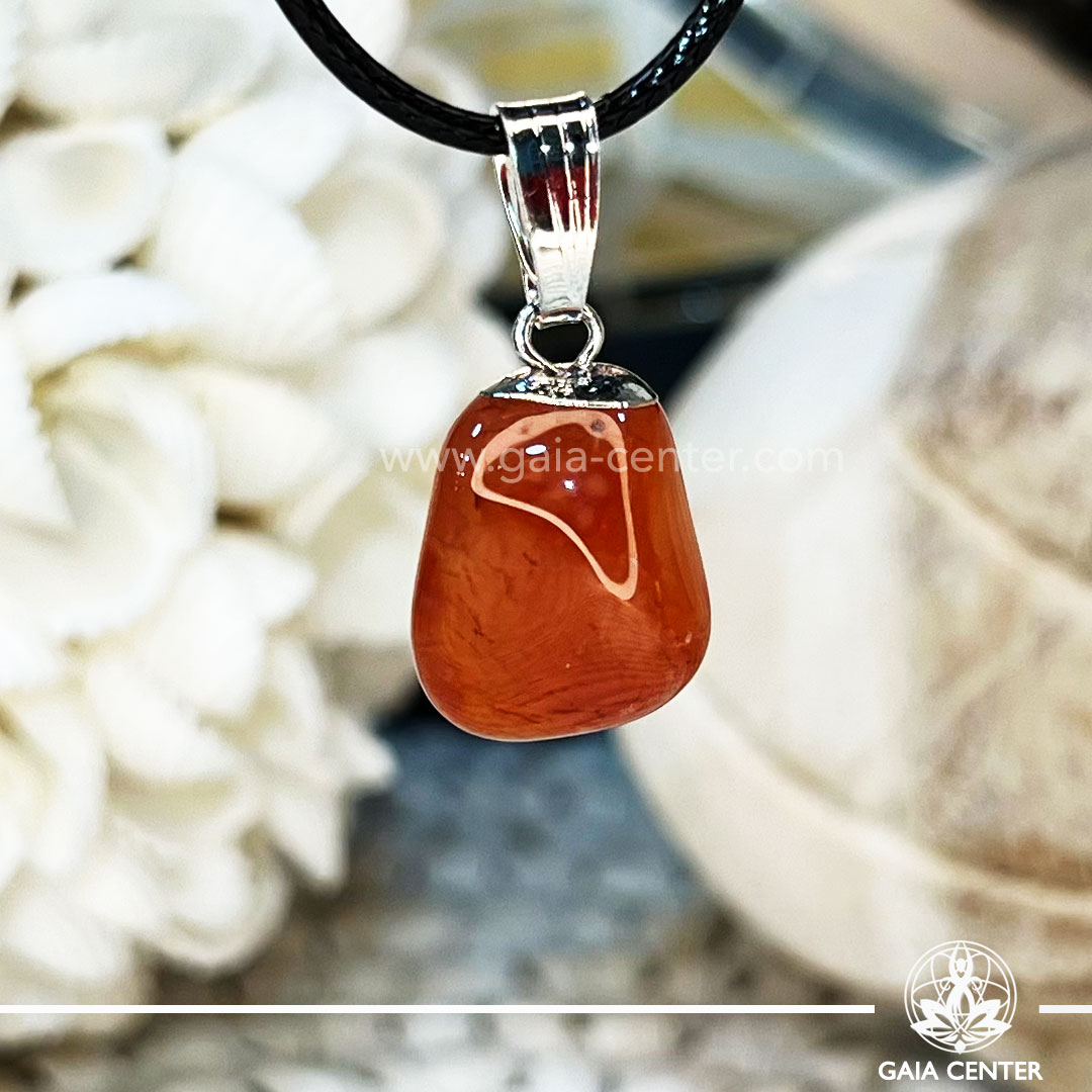 Crystal Pendant - Carnelian polished with electroplated bail and string at GAIA CENTER Crystal Shop CYPRUS. Crystal jewellery and crystal pendants at Gaia Center crystal shop in Cyprus. Order online top quality crystals, Cyprus islandwide delivery: Limassol, Larnaca, Paphos, Nicosia. Europe and Worldwide shipping.