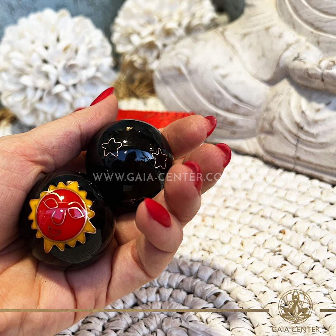 Pair of Stress or Health Balls - Sun and Moon black metal color design. These health balls have been used in Chinese medicine, in order to support the flexibility and blood circulation in hands and fingers. Wellbeing and feng shui products selection at Gaia Center | Crystals & Incense shop in Cyprus. Order online, Cyprus islandwide delivery: Limassol, Paphos, Larnaca, Nicosia. Europe and worldwide shipping.
