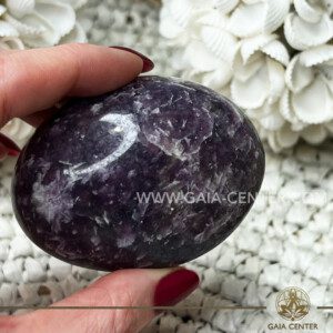 Lepidolite Palm Stone Large |70x50mm| size from Madagascar at GAIA CENTER Crystal Shop CYPRUS. Crystal jewellery and crystal pendants at Gaia Center crystal shop in Cyprus. Order online top quality crystals, Cyprus islandwide delivery: Limassol, Larnaca, Paphos, Nicosia. Europe and Worldwide shipping.