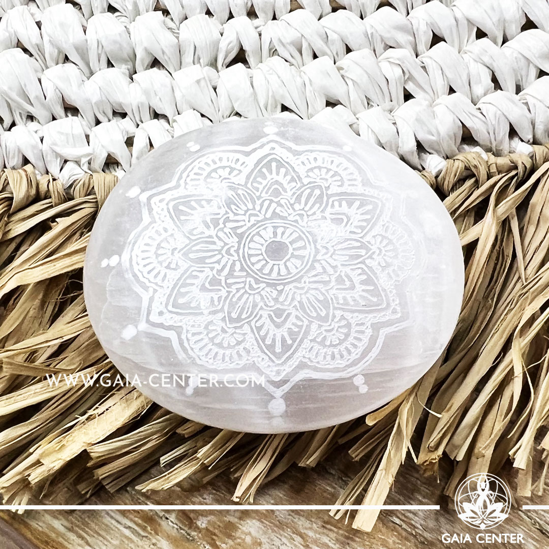 White Selenite crystal polished palm stone with engraved mandala symbol. Crystal points, towers and obelisks selection at Gaia Center Crystal shop in Cyprus. Order crystals online, Cyprus islandwide delivery: Limassol, Larnaca, Paphos, Nicosia. Europe and Worldwide shipping.