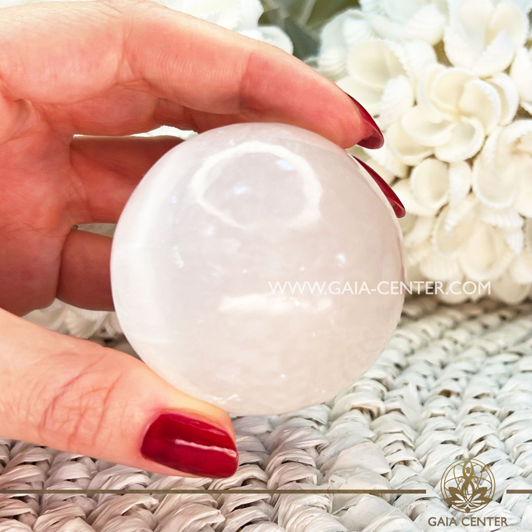 Selenite Crystal Sphere |55mm| at Gaia Center Crystal shop in Cyprus. Crystal and Gemstone Jewellery Selection at Gaia Center in Cyprus. Order online, Cyprus islandwide delivery: Limassol, Larnaca, Paphos, Nicosia. Europe and Worldwide shipping.