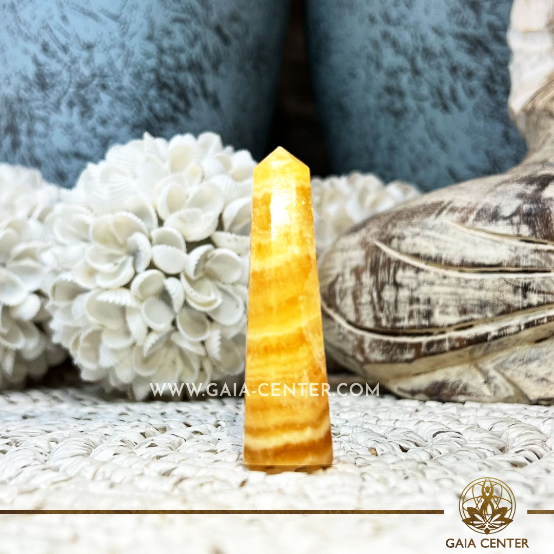 Crystal Obelisk polished point tower Yellow Fluorite. Crystal points, towers and obelisks selection at Gaia Center Crystal Shop in Cyprus. Order online, Cyprus islandwide delivery: Limassol, Larnaca, Paphos, Nicosia. Europe and Worldwide shipping.