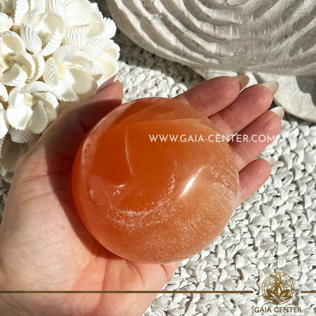Orange Selenite Crystal Sphere XLarge |75mm| ball from Morocco at GAIA CENTER Crystal Shop CYPRUS. Crystal jewellery and crystal pendants at Gaia Center crystal shop in Cyprus. Order online top quality crystals, Cyprus islandwide delivery: Limassol, Larnaca, Paphos, Nicosia. Europe and Worldwide shipping.