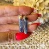 Blue Kyanite crystal earrings in a Rough shape with sterling silver setting from Brazil at Gaia Center Crystal shop in Cyprus. As you wear the Blue Kyanite Crystal earrings, actively embrace its calming properties. It actively invites tranquility into your life, making it an ideal accessory for those seeking inner peace and balance amidst life's challenges. Order crystals online, Cyprus islandwide delivery: Limassol, Larnaca, Paphos, Nicosia. Europe and Worldwide shipping.