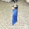 Blue Kyanite crystal pendant in a Rough shape with sterling silver setting from Brazil at Gaia Center Crystal shop in Cyprus. As you wear the Blue Kyanite Crystal Pendant, actively embrace its calming properties. It actively invites tranquility into your life, making it an ideal accessory for those seeking inner peace and balance amidst life's challenges. Order crystals online, Cyprus islandwide delivery: Limassol, Larnaca, Paphos, Nicosia. Europe and Worldwide shipping.