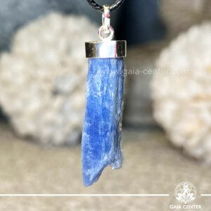 Blue Kyanite crystal pendant in a Rough shape with sterling silver setting from Brazil at Gaia Center Crystal shop in Cyprus. As you wear the Blue Kyanite Crystal Pendant, actively embrace its calming properties. It actively invites tranquility into your life, making it an ideal accessory for those seeking inner peace and balance amidst life's challenges. Order crystals online, Cyprus islandwide delivery: Limassol, Larnaca, Paphos, Nicosia. Europe and Worldwide shipping.