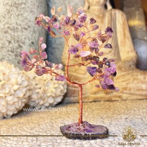 Amethyst Crystal Tree with Purple Agate Base |100 stones| at Gaia Center Crystal shop in Cyprus. Amethyst is associated with calming and balancing energies. The presence of this crystal in tree form, rooted in a Purple Agate base, may create a tranquil environment, aiding in stress relief and emotional equilibrium. Order crystals online, Cyprus islandwide delivery: Limassol, Larnaca, Paphos, Nicosia. Europe and Worldwide shipping.