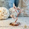 Rock Quartz Crystal Tree with Black Agate Base |35 stones| at Gaia Center Crystal shop in Cyprus. Rock Quartz, known as the "Master Healer," is believed to amplify clarity of thought and enhance mental focus. The crystal tree may radiate these qualities, promoting clear thinking and decision-making. Order crystals online, Cyprus islandwide delivery: Limassol, Larnaca, Paphos, Nicosia. Europe and Worldwide shipping.